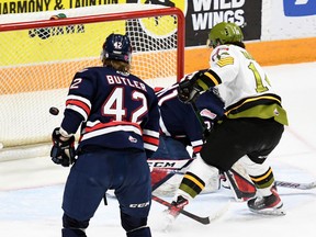 The North Bay Battalion's Dalyn Wakely scores on Oshawa Generals goaltender Carter Bickle as Cameron Butler observes in second-period action of their Ontario Hockey League game Sunday. The teams completed their regular-season schedules.
Sean Ryan Photo
