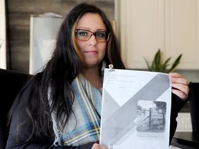 Sig Leslie holds a copy of the Brockville Municipal Drug Strategy report on Wednesday, April 20, 2022. (RONALD ZAJAC/The Recorder and Times)