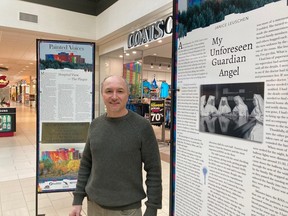 Poet Tom Leduc stands amid the Painted Voices display at the New Sudbury Centre on Wednesday. The panel in the foreground is a reflection by former nurse Janice Leuschen on her experience with the nuns at Sudbury General and one in particular — Sister Cecelia — who comforted her on a difficult day.