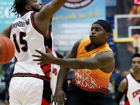 Braylon Rayson, right, of the Sudbury Five, passes the ball around Sam Muldrow, of the Windsor Express, during basketball action at the Sudbury Community Arena in Sudbury, Ont. on Thursday February 6, 2020.