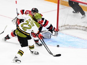 Matvey Petrov of the visiting North Bay Battalion is foiled on a scoring chance by Ranvir Gill-Shane of the Ottawa 67's with goaltender Max Donoso helpless as the Troops' Michael Podolioukh observes Monday night. The teams play Game 4 of their Ontario Hockey League first-round playoff series Wednesday night at Ottawa.
Sean Ryan Photo