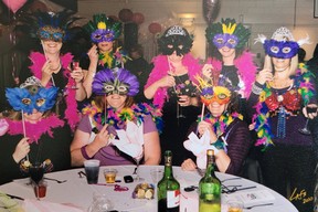 A team of women who participated in the Braz for the Cause fundraiser called themselves the Mardi Braz and dressed in masks, feather boas and beads.  Submitted photo