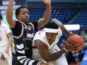 Jaylen Bland of the Sudbury Five tries to get past a Windsor Express player during NBL action from the Sudbury Community Arena on Sunday afternoon. Sudbury defeated Windsor 125-100.