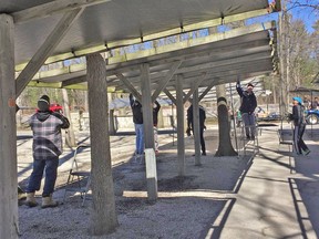 Crews prepare the canopies at the Pinery Market as opening day approaches. Handout