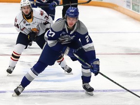 Quentin Musty, right, of the Sudbury Wolves, breaks to the net during OHL action against the Barrie Colts at Sudbury Community Arena in Sudbury, Ont. on Tuesday, January 25, 2022. Musty was the first-overall pick in the 2021 OHL Priority Selection.