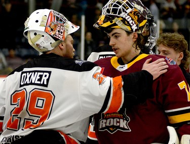 Lumberjacks goalie Liam Oxner and Rock goalie Gavin McCarty exchange pleasantries following Hearst’s 4-3 win over Timmins in Game 7 of the NOJHL East Division final series at the McIntyre Arena Friday night. The Lumberjacks will now move on to meet the West Division’s Soo Thunderbirds in the NOJHL championship series. THOMAS PERRY/THE DAILY PRESS