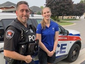 Kingston Police Const. Greg Smith, left, with Kate Vanderlaan, prior to her Youth in Police Initiative ride-along in the summer of 2021.