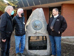 Karl Crevar, left, and Peter Page, both of the Ontario Network of Injured Workers, chat with Henri Giroux, president of the North Bay and District Labour Council, on the national Day of Mourning for workers killed and injured on the job, Thursday, outside North Bay City Hall.
PJ Wilson/The Nugget