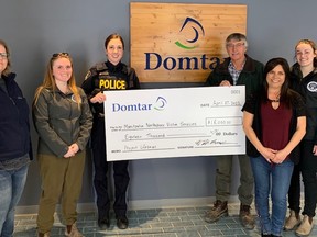 Members of the Manitoulin OPP and Manitoulin Northshore Victim Services accept an $18,000 donation from Domtar to support Project Lifesaver, a program that equips vulnerable people — such as those with dementia — with tracking devices so they can be found if they happen to wander.