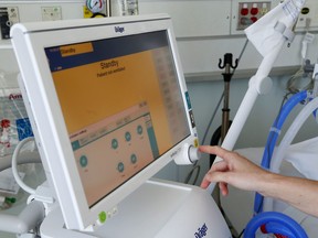 A Quinte Health Care worker demonstrates the use of a ventilator in the intensive care unit of Belleville General Hospital. The unit had four COVID-19 patients as of Friday and there were a total of 31 in the hospital.