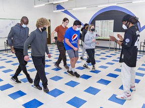 STEAM Academy students at Six Nations Polytechic in Brantford, enrolled in the Outside Looking In dance program rehearse their dance number with choreographer Josh Taylor (right) on Wednesday April 27, 2022.