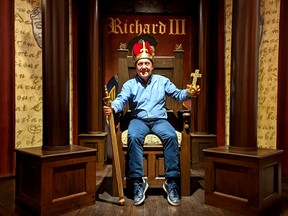 King John Kastner, general manager of the Stratford Perth Museum, poses for a photo seated atop a throne on a scaled-down recreation of the Stratford Festival's famous thrust stage created by the Off the Wall Stratford Artists Alliance. Museum visitors will also be able to dress in royal regalia and have their photos taken in the Stratford Festival exhibit, which first opened last year and was enhanced over the winter with more costume pieces and set decorations. Galen Simmons/The Beacon Herald/Postmedia Network