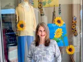 Josie Myles stands in front of her store, Josie’s Fashions in downtown Wiarton. Thirteen local storefronts are displaying art being auctioned off to raise money for relief efforts in Ukraine. The silent auction ends May 6. (Submitted)