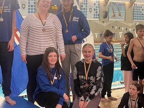 Last month, Tri Leisure Centre Blue Fins Madison Sedore (back left), Halle Hennig (back right), Bryn Majeau (front left), and Makena Day (front right) won the bronze medal in the girls 14–15 4x50-metre medley relay at the 2022 Alberta Northwest Territories Pool Lifesaving Championships in Lethbridge. Photo supplied by TLC Blue Fins.