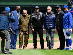 Chicago Cubs Hall of Famers Lee Smith, Billy Williams, Fergie Jenkins, Ryne Sandberg and Andre Dawson pose for a photo after throwing the ceremonial first pitch before a game between the Cubs and the Milwaukee Brewers on opening day at Wrigley Field on April 7, 2022, in Chicago, Illinois. (Photo by Quinn Harris/Getty Images)
