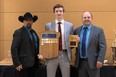 Assistant coach Dan Meyers and head coach Trevor Blevins hand out an award to Curtis Hammond during the Melfort Mustangs banquet. Meyers will be returning to the team as assistant coach for the 2022/2023 season. 
Photo: Facebook/Melfort Mustangs