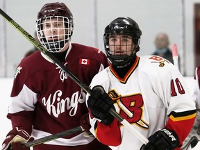 Blenheim Blades' Ayden McKinlay, right, and Dresden Kings' Tyler Simon jockey for position in front of the Kings' net in the second period at Blenheim Memorial Arena on Sunday, April 3, 2022. Mark Malone/Chatham Daily News/Postmedia Network