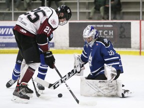 London Nationals goalie Aiden Berry makes a save against Chatham Maroons' Cameron Graham in the first period of Game 2 in a GOJHL Western Conference semifinal at Chatham Memorial Arena in Chatham, Ont., on Friday, April 22, 2022. Mark Malone/Chatham Daily News/Postmedia Network