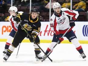 Windsor Spitfires' Wyatt Johnston (55) battles Sarnia Sting's Nolan Dann (9) in front of the Spitfires' net in the first period at Progressive Auto Sales Arena in Sarnia, Ont., on Tuesday, April 26, 2022. Mark Malone/Chatham Daily News/Postmedia Network