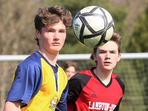 Pain Court Patriotes' Owen Caron, left, and Lambton-Kent Cardinals' Hayden Jackson watch the ball in the first half of an LKSSAA senior boys' soccer game at Ecole Secondaire de Pain Court in Pain Court, Ont., On Thursday, April 28 , 2022. Mark Malone / Chatham Daily News / Postmedia Network