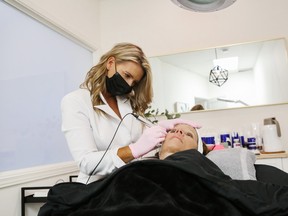 Skin therapist Julie Gole of Skin Essentials performs a medical microneedling procedure on a client.