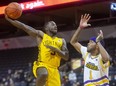 Chris Jones of the London Lightning throws up a hook shot over Jamyrin Jackson of the Lansing Pharaohs in NBL action at Budweiser Gardens in London on Sunday March 6, 2022. Mike Hensen/The London Free Press/Postmedia Network