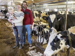 Marja DeBoer-Marshall, Laurence Marshall and their daughter Mavis, 1, run Golspie Dairy near Woodstock with Marshall's parents Ron and Wendy Marshall. The dairy is installing a vending machine that will dispense milk processed at its new processing plant.