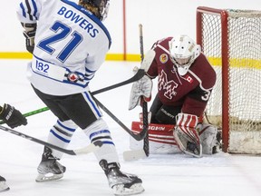 London Nationals' Rylan Bowers closes in on Chatham Maroons goalie Nolan DeKoning to make sure DeKoning holds on to the puck during the first period in Game 1 of their GOJHL Western Conference semifinal at the Western Fair Sports Centre in London, Ont., on Wednesday, April 20, 2022. (Mike Hensen/The London Free Press/Postmedia Network)