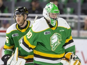 London Knights goalie Brett Brochu stares at the bench after a fall and appearing to be in pain as he starts a playoff series against the Kitchener Rangers on Thursday, April 21, 2022, at Budweiser Gardens in London, Ont. Mike Hensen/The London Free Press/Postmedia Network