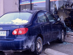 A car jumped a parking barrier and hit Nortowne Plaza Tuesday afternoon in Owen Sound. Paramedics examined the driver at the scene. (Owen Sound Police Service photo)