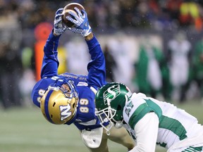 Blue Bombers receiver Kenny Lawler goes up for a touchdown catch against the B.C. Lions at IG Field last season.