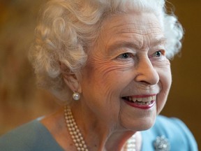 In this file photo taken Feb. 5, 2022, Britain's Queen Elizabeth II smiles during a reception in the Ballroom of Sandringham House, the Queen's Norfolk residence, as she celebrates the start of the Platinum Jubilee.