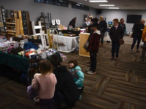 Shoppers check out the many booths set up throughout the Town and Country Centre during the Airdrie Farmers Market's Spring Fling on April 16. The turnout made it seem like things were back to normal following a turbulent couple of years thanks to the COVID-19 pandemic.  Photo by Riley Cassidy/The Airdrie Echo/Postmedia Network Inc.
