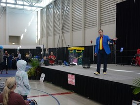 Magician Christopher Cool asks his audience for suggestions on which socks he should wear during his performance that the Airdrie Home and Lifestyle Show in 2022.