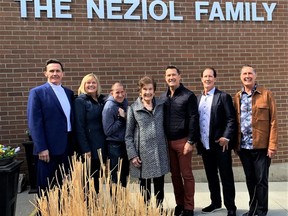 The home of the Crossing All Bridges Learning Centre on Sky Acres Drive will be known as the Neziol Family Building. Attending a naming ceremony on Saturday were members of the family: Gerry Neziol (left), Nancy McColeman, Jordan McColeman, Stella Neziol, Paul Neziol, Peter Neziol and Bernard Neziol.