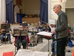 Paul Nicholson conducts members of the Brantford Memorial Concert Band during a rehearsal on Monday April 4, 2022 in Brantford, Ontario. The band will perform a free concert at the Sanderson Centre on April 24. PHOTO BY JUNE YOUNG