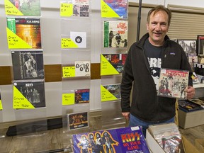 Vendor Mick Gillings of Brantford holds an original red vinyl 45-rpm of The Beatles single Hard Day's Night that he was selling for $55 at the Brantford Record Show.
