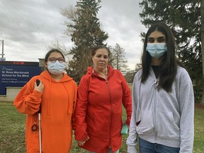 Stephanie Antone and her daughter, Yehati (left), and fellow W. Ross Macdonald School student Mehak Aziz participated in a demonstration on Wednesday calling on the Ministry of Education to complete much-needed repairs at the Brant Avenue school. Antone is the chair of the school's parent council.