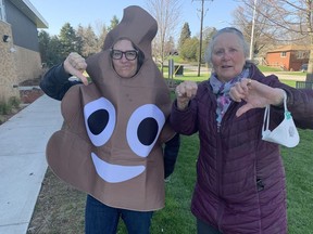 Kate Broussard (left) dressed up as a poop emoji to attend a public information meeting Thursday, April 28 about Panattoni Development's plans to build a large warehouse in St. George. She was accompanied by her mother Valerie Simpson who also objects to the proposal. VINCENT BALL