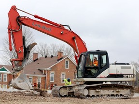 Workers with L.A. Knapp Construction and Maurice's Masonry and Forming work on a seniors' apartment complex on the site of the former St. Vincent de Paul Hospital in Brockville on April 1. (FILE PHOTO)