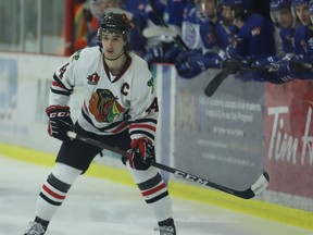Brockville captain Thomas Haynes near the Navan bench during a Braves-Grads game at the Memorial Centre on March 17. Brockville's final game before the playoffs is at home against Navan on Friday night.
File photo/The Recorder and Times