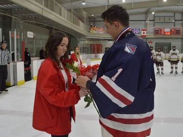 Leo Boivin Showcase medal girl Mackenzie Dumoulin receives flowers from South Grenville goalie Riley Hogan, who was named second star of the Rangers' game with OHA on Friday afternoon.
Tim Ruhnke/The Recorder and Times