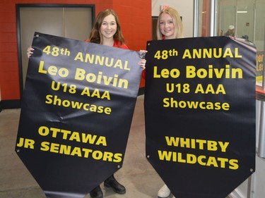 Mallory Kirkby (left) and Holly Shipclark are among the many volunteers pitching in at the opening ceremony of the 2022 Leo Boivin Showcase.
Tim Ruhnke/The Recorder and Times
