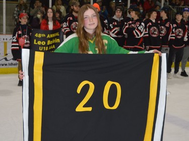 A flag with Leo Boivin's Boston Bruin jersey number and colours is carried by Isabel Curry during the showcase's opening ceremony.
Tim Ruhnke/The Recorder and Times