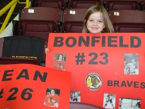 Ellie Hannaford, 5, shows her support for Ryan Bonfield and Caleb Kean of the Brockville Braves during their playoff opener at home on Tuesday night.
Tim Ruhnke/The Recorder and Times/Postmedia Network