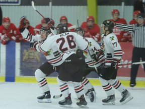 Ryan Bonfield and his Brockville teammates celebrate after scoring a power-play goal with about 22 seconds left in regulation to take a 2-1 lead on Pembroke in game five of their CCHL quarter-final series on Tuesday night. Luke Tchor added an empty-netter to make the final 3-1. Brockville avoided elimination, but the Lumber Kings can still win the series with a victory at home in game six Wednesday night.
Tim Ruhnke/The Recorder and Times/Postmedia Network