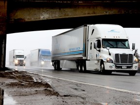 Transport trucks head west on Highway 401 in Brockville on Thursday afternoon. The expansion of the 401 locally is among the many projects in the provincial government's Eastern Ontario transportation plan. (RONALD ZAJAC/The Recorder and Times)
