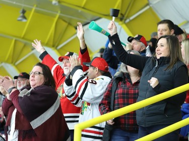 Brockville fans (including Braves director of operations Jaime McDougall, left) rise when Ryan Bonfield scores in the second period to tie game seven with Pembroke 1-1. Caleb Kean's winning goal for Brockville followed more than three-and-a-half hours later.
Tim Ruhnke/The Recorder and Times