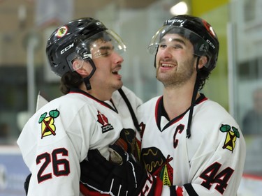 Caleb Kean (left), who scored the game seven and quarter-final series winner for the Braves, is embraced by Brockville captain Thomas Haynes.
Tim Ruhnke/The Recorder and Times