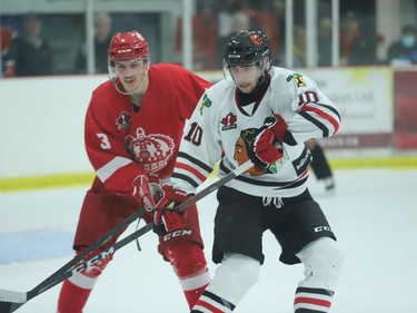 Pembroke defenceman Sawyer Prokopetz (left) and Brockville forward Colin Stacey during the second period of game seven between the Lumber Kings and Braves on Friday, April 22.
Tim Ruhnke/The Recorder and Times/Postmedia Network